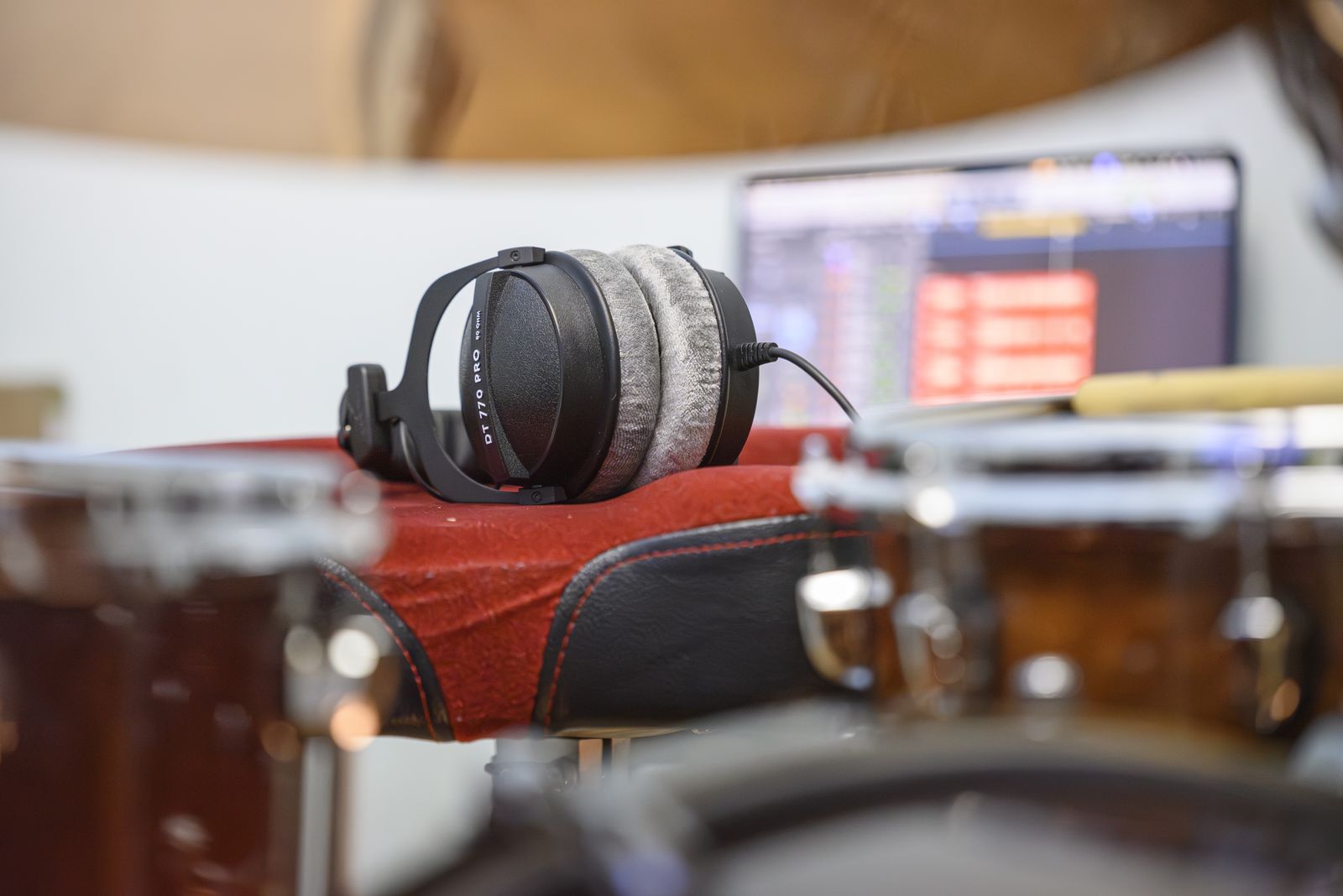 Headphones and Logic Pro session in the home studio